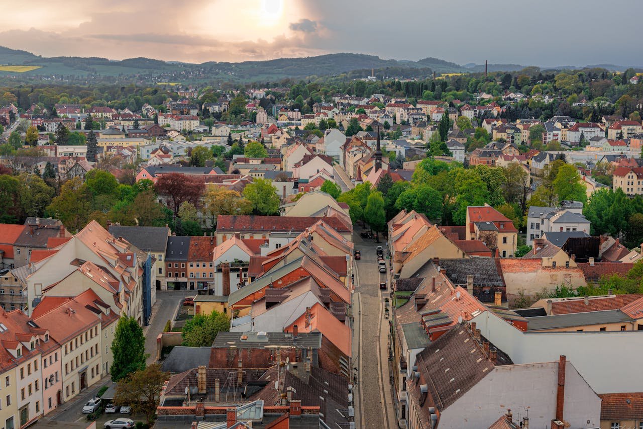 Aerial view of Zittau, Germany showcasing the town's historic architecture amidst lush greenery.